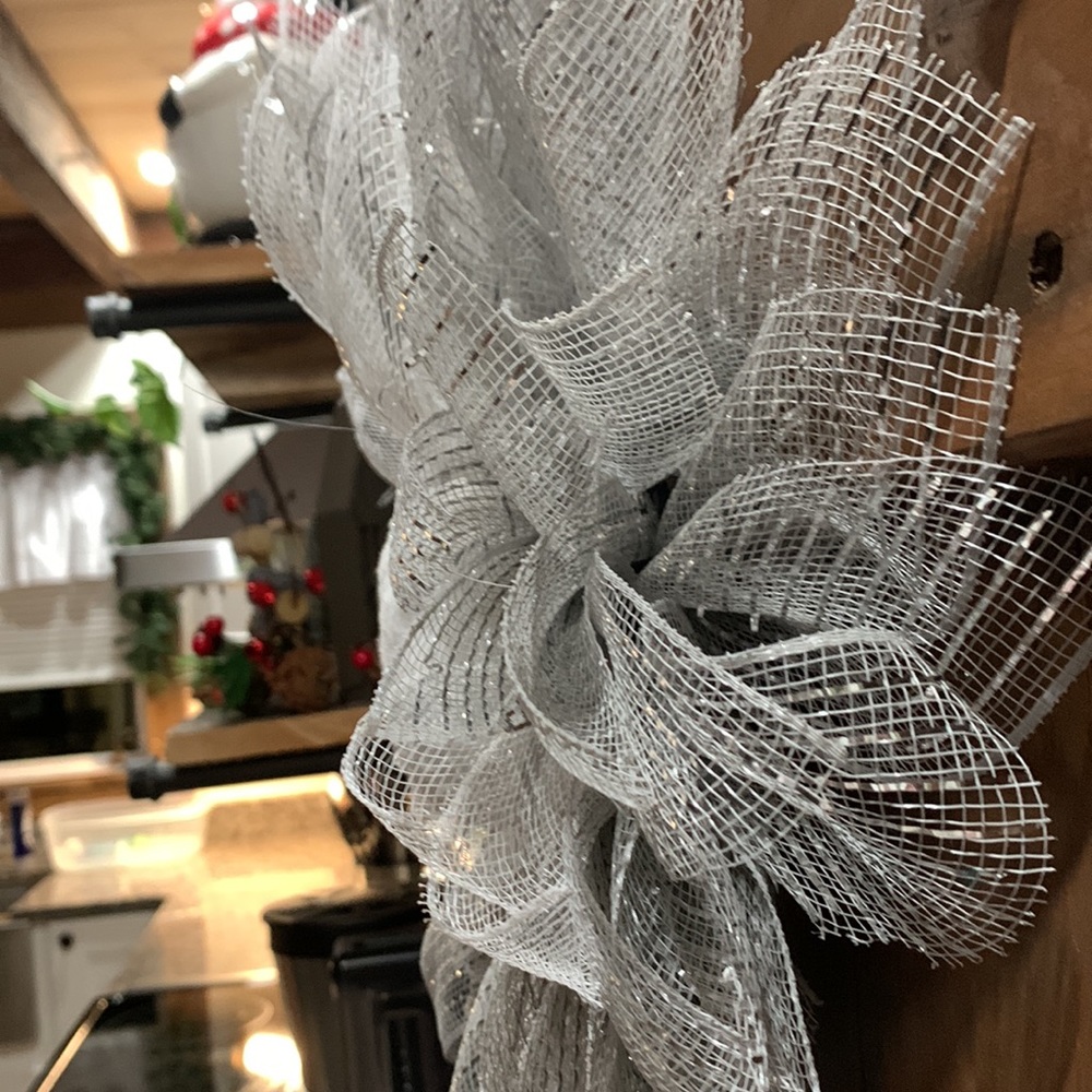 This snowy, wintery looking flower wreath is around 16”. - Picture 5 of 6